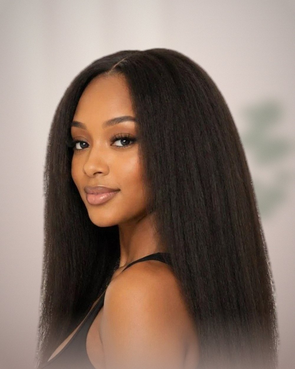 Campaign concept: woman with long kinky straight hair in soft daylight